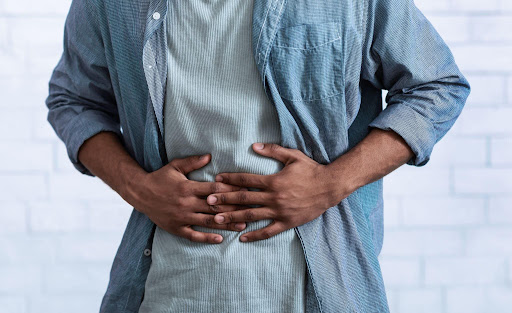 Abdominal pain symptoms in men caused by indigestion, acidity or digestive health issues
